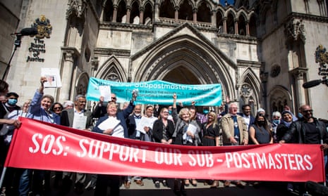 Some of the 39 subpostmasters celebrate outside the Royal Courts of Justice, London, with family and friends