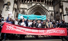 A group of post office operators celebrate outside the Royal Courts of Justice, London, with family and friends. A banner reads: 'SOS – support our sub-postmasters'. Photographed on 23 April 2021