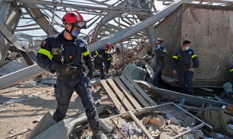 French rescue workers search through the rubble in the devastated Beirut port