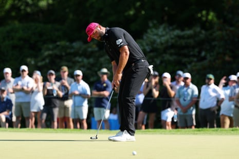 Jon Rahm of Spain putts on the 11th green.