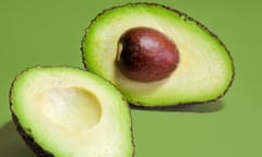 A Hass variety avocado sliced into two halves