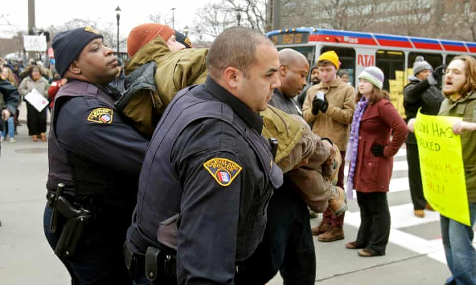 Police arrest a demonstrator protesting against the death of Tamir Rice in Cleveland.