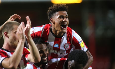 Ollie Watkins celebrates with Brentford teammates after the play-off game against Swansea.