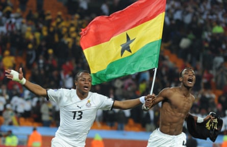 André Ayew (left) and John Paintsil celebrate Ghana’s qualification for the last 16 at the 2010 World Cup.