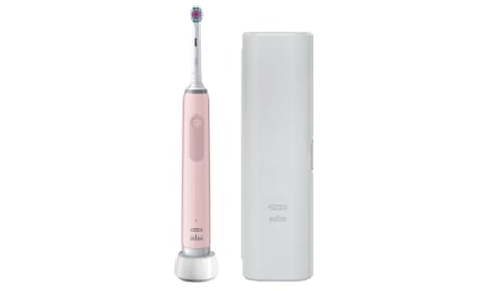 A pink and white electric toothbrush next to its white travel case