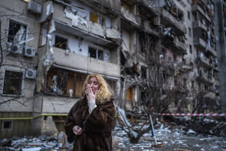 Natali Sevriukova in distress next to her house after a rocket attack the city of Kyiv, Ukraine, 25 February