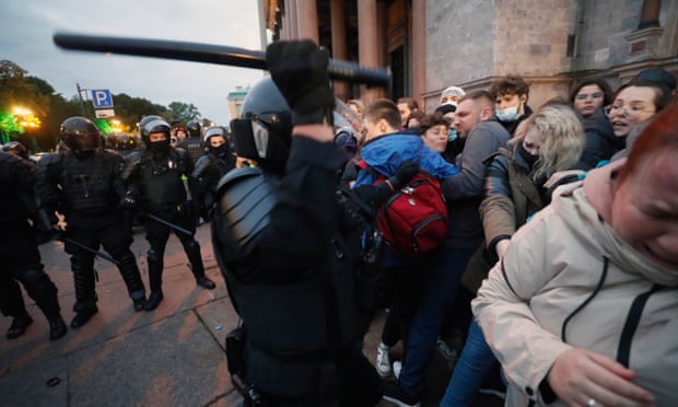 Police officers detain protesters in central St.  Petersburg