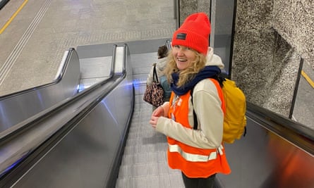 Doris Maklewska, of Grupa Centrum volunteers at Warsaw central station, goes to meet new arrivals from Ukraine.