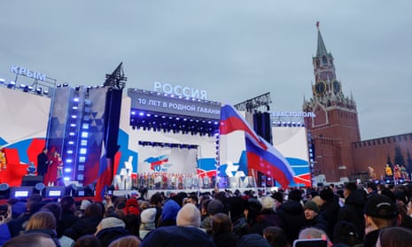 People attend a rally in Red Square in central Moscow.