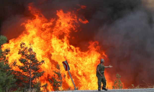 firefighters battle the wildfires at Feslegen Plateau in Milas district of Mugla.