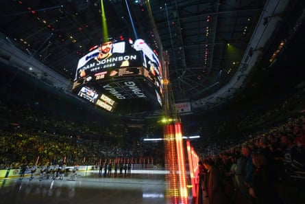 Nashville Predators and Vancouver Canucks players and spectators observe silence for Adam Johnson as the sport reels from his death.