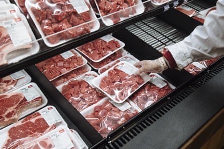 A worker restocks beef at a supermarket in Paramus, New Jersey.
