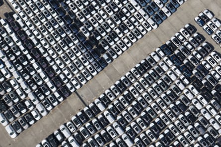 Chinese-made vehicles wait to be loaded on to ships for export in Shanghai