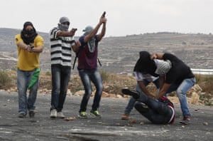 Israeli security forces detain a Palestinian stone thrower