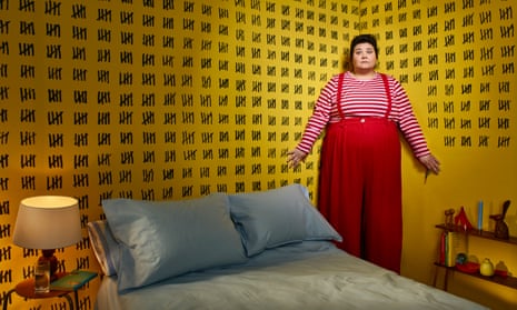 Photograph of Sofie Hagen in a bedroom with lots of marks counting days on the walls