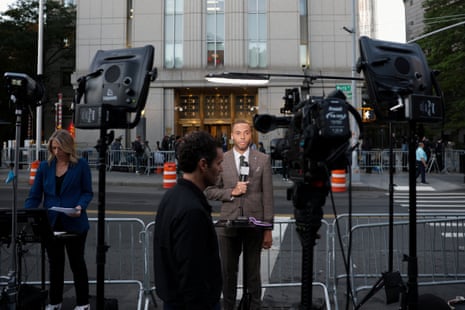 Members of the media work outside the court as they wait for the sentencing hearing of Sean "Diddy" Combs.
