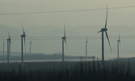 Windmills are seen from a high-speed train travelling from Beijing to China’s north-western Hebei province.