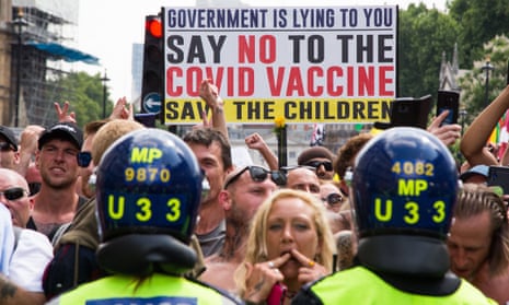 Anti-vaccination and anti-Covid restrictions demonstrators march to Parliament Square in London, 19 July 2021