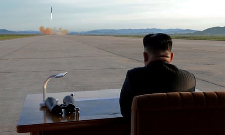 North Korean leader Kim Jong-un watches the launch of a Hwasong-12 missile in an undated photo released by the Korean Central News Agency in September.