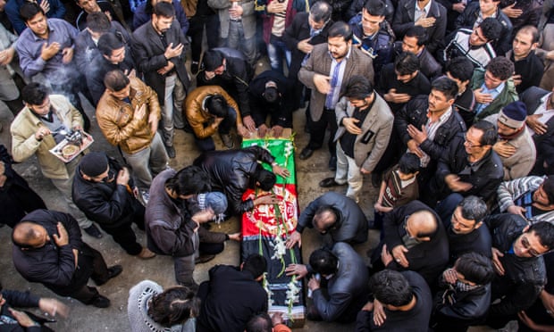 Crowds at a funeral ceremony held in Mashhad for an Iran-based Afghan killed in Syria