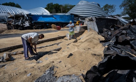 Ukrainians salvage barley and peas three days after five Russian missiles struck a grain storage facility in Pavlivka, Odesa region, on 24 July 2023.