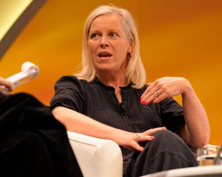 Charlotte Moore speaking on stage at an event