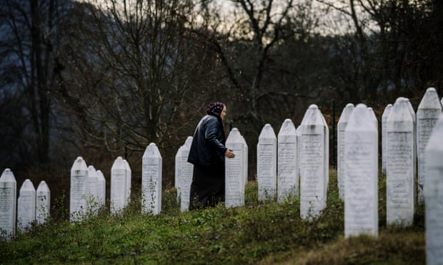 A Bosnian woman offers prayers at the Potocari memorial near Srebrenica.