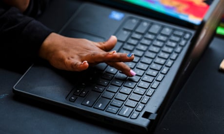a child learns how to find a key on a keyboard