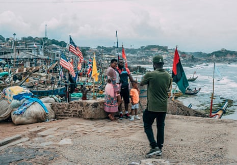 Tourists pose for pictures in 2019 at the Cape Coast Castle, Ghana, considered the ancestral home of many African Americans.
