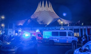 Police and emergency vehicles are seen outside Tempodrom after a shooting