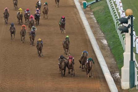 Brian Hernandez Jr rides Mystik Dan, right, across the finish line to win the 150th running of the Kentucky Derby at Churchill Downs on Saturday.