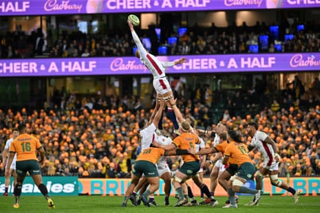 England's Nick Isiekwe wins the line out ball during the rugby Test match between England and Australia at the SCG in Sydney on Saturday. During the match an intruder climbed the big screen and appeared to urinate from the roof.  