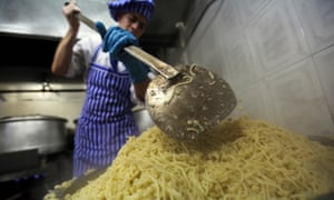 A cook prepares koshary in Cairo.
