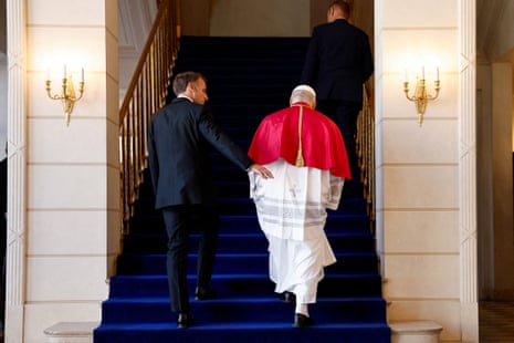 France's President Emmanuel Macron (L) walks with Pope Leo XIV (L) before their meeting at the Elysee Presidential Palace, in Paris on September 25, 2026 at the start of his four days visit to France.