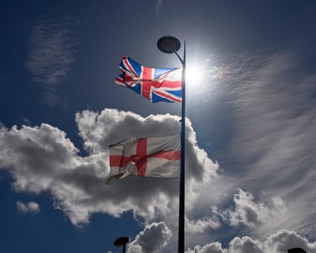 A union jack and a St George flag on a lamp-post