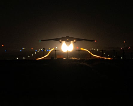 A stealth bomber taking off at night