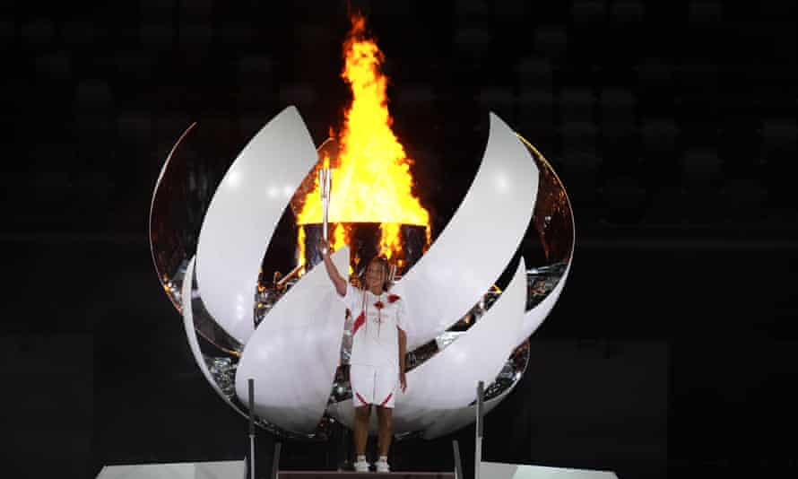 Japan’s Naomi Osaka lights the cauldron