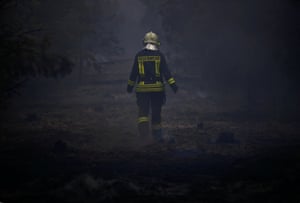 forest berlin fire shut residents told smoke windows engulfs fires firefighter helps put near