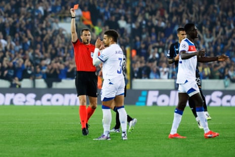Max Aarons of Rangers is shown a straight red card