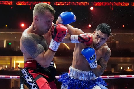 Jai Opetaia, right, lands a punch on Mairis Briedis during their cruiserweight title fight.
