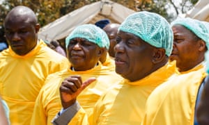 Zimbabwe’s president, Emmerson Mnangagwa, visits a medical camp outside the Glen View clinic in Harare.