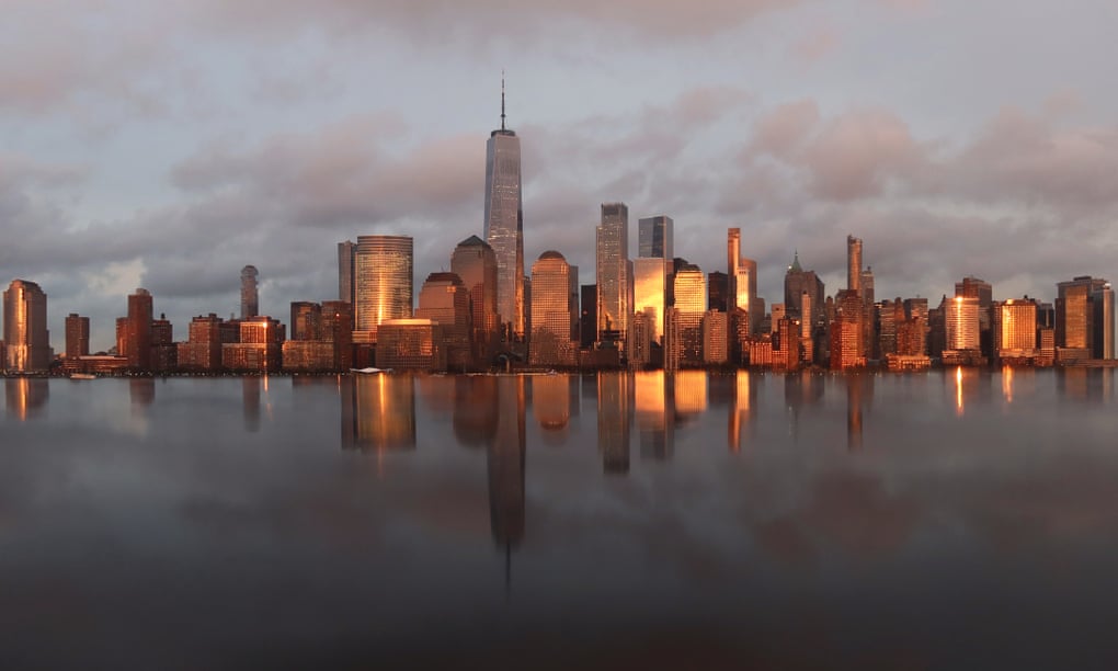 The sun sets on the skyline of lower Manhattan.