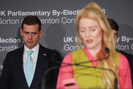 Reform UK party candidate Matt Goodwin looks on as Spencer speaks