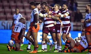 Tommy Leuluai of Wigan celebrates after scoring the first try of the semi-final.