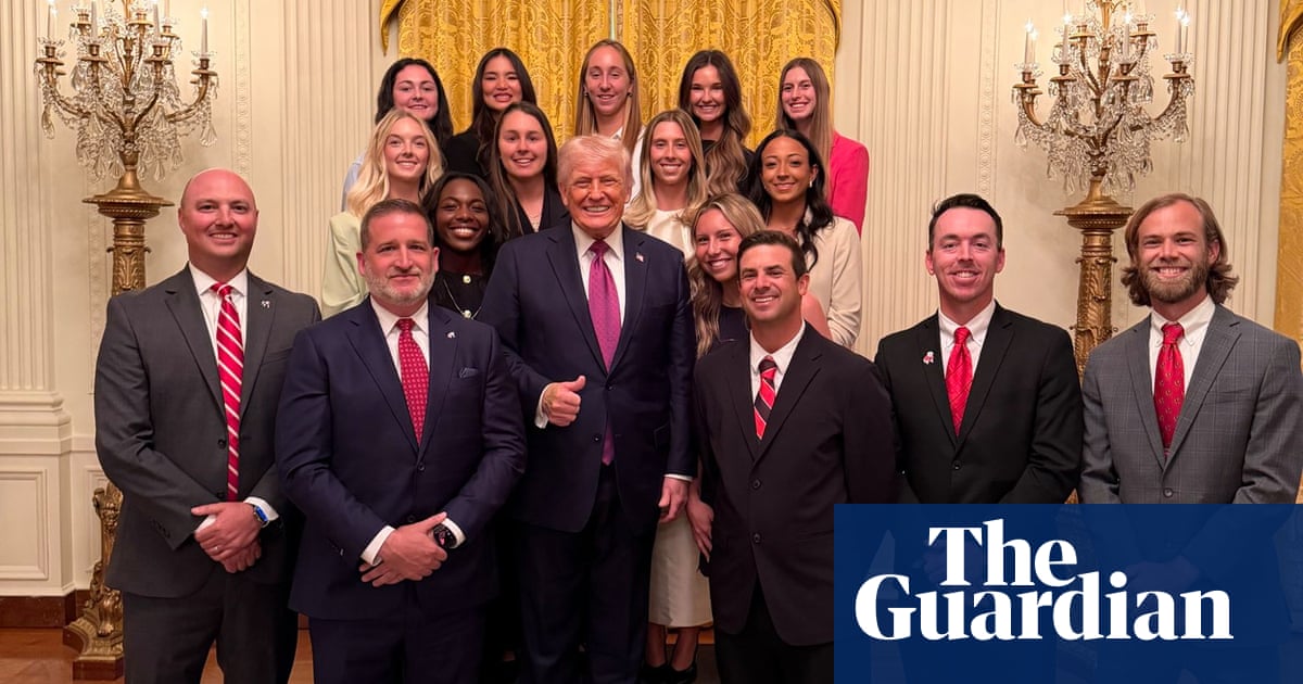 Trump and five guys celebrate the historic achievement of standing in front of the women who actually won the championship.