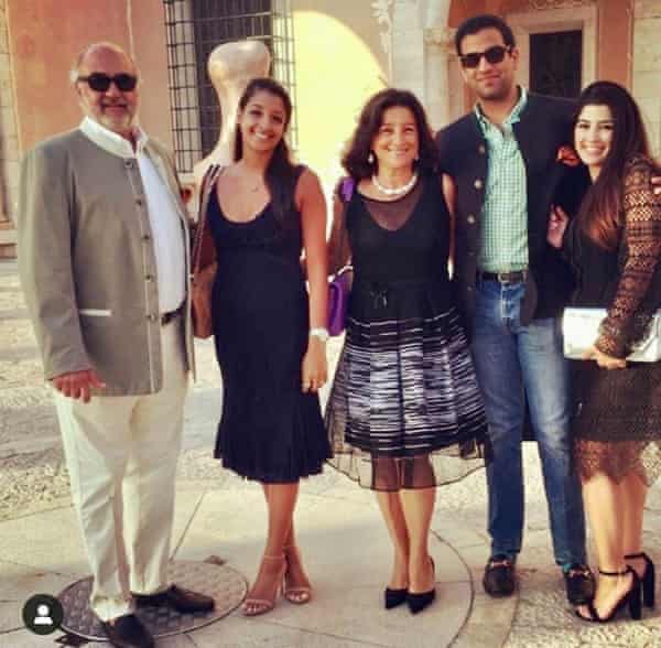 Family photograph of a mother, father and three adult children – two daughters and a son
