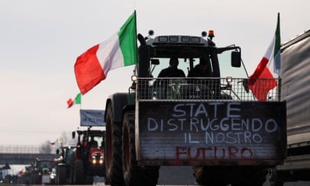Farmers drive tractors during a protest at Melegnano toll booth, near Milan, Italy.