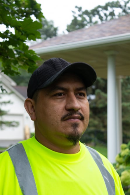 man in a baseball cap and a hi-vis shirt