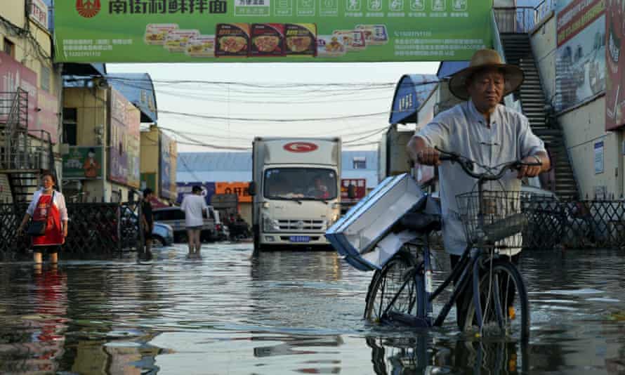 Flooding in Xinxiang in central China’s Henan Province in June. The Intergovernmental Panel on Climate Change report said extremes such as heat waves, droughts, floods and storms would become more common across the planet as temperatures rise.