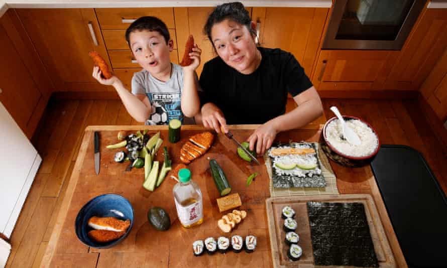 Nina Matsunaga and her 8-year-old son Ernie, making sushi together at home.